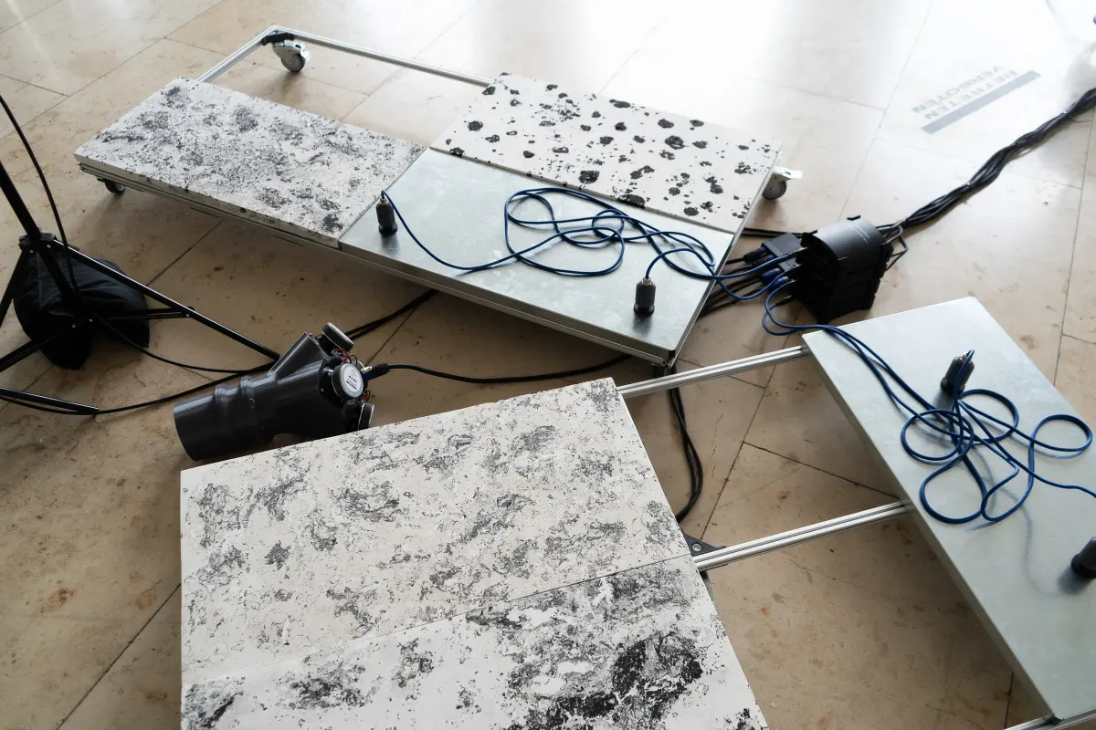 “chronos - constant growth constant decay” (2025) - self build geophones and speaker combination sending sound impulse through scagliola and metal plates